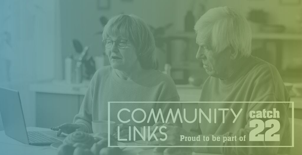 An elderly couple use a laptop at their kitchen table. The Community Links logo is overlayed.