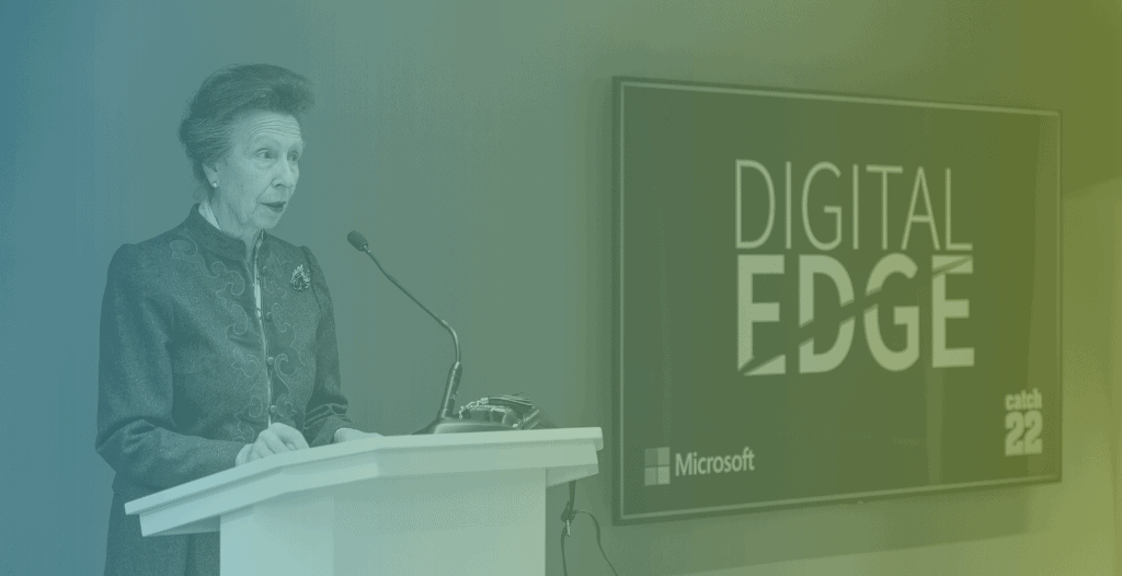 HRH The Princess Royal talks to attendees with a Digital Edge logo on a screen to the right.