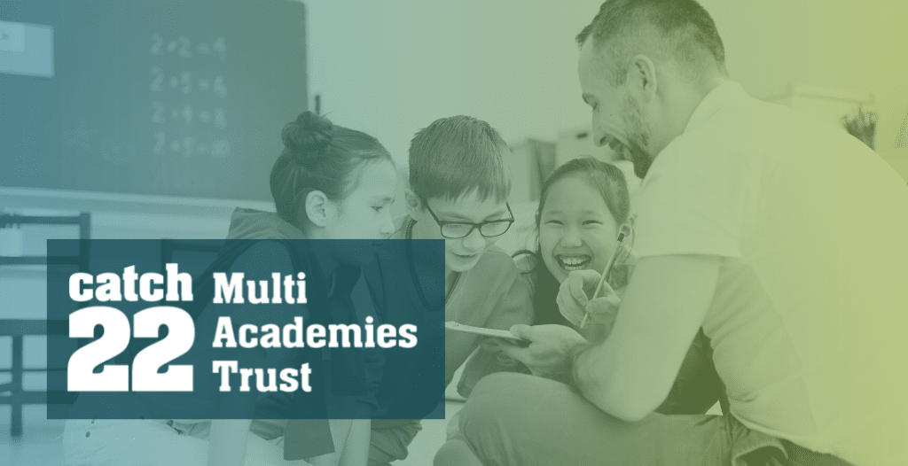 Three children sit on the floor with their teacher, looking at a notebook that he is holding out. Overlaid is the Catch22 Multi Academies Trust logo.