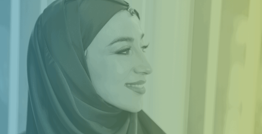 Side-profile portrait of a woman in a hijab.